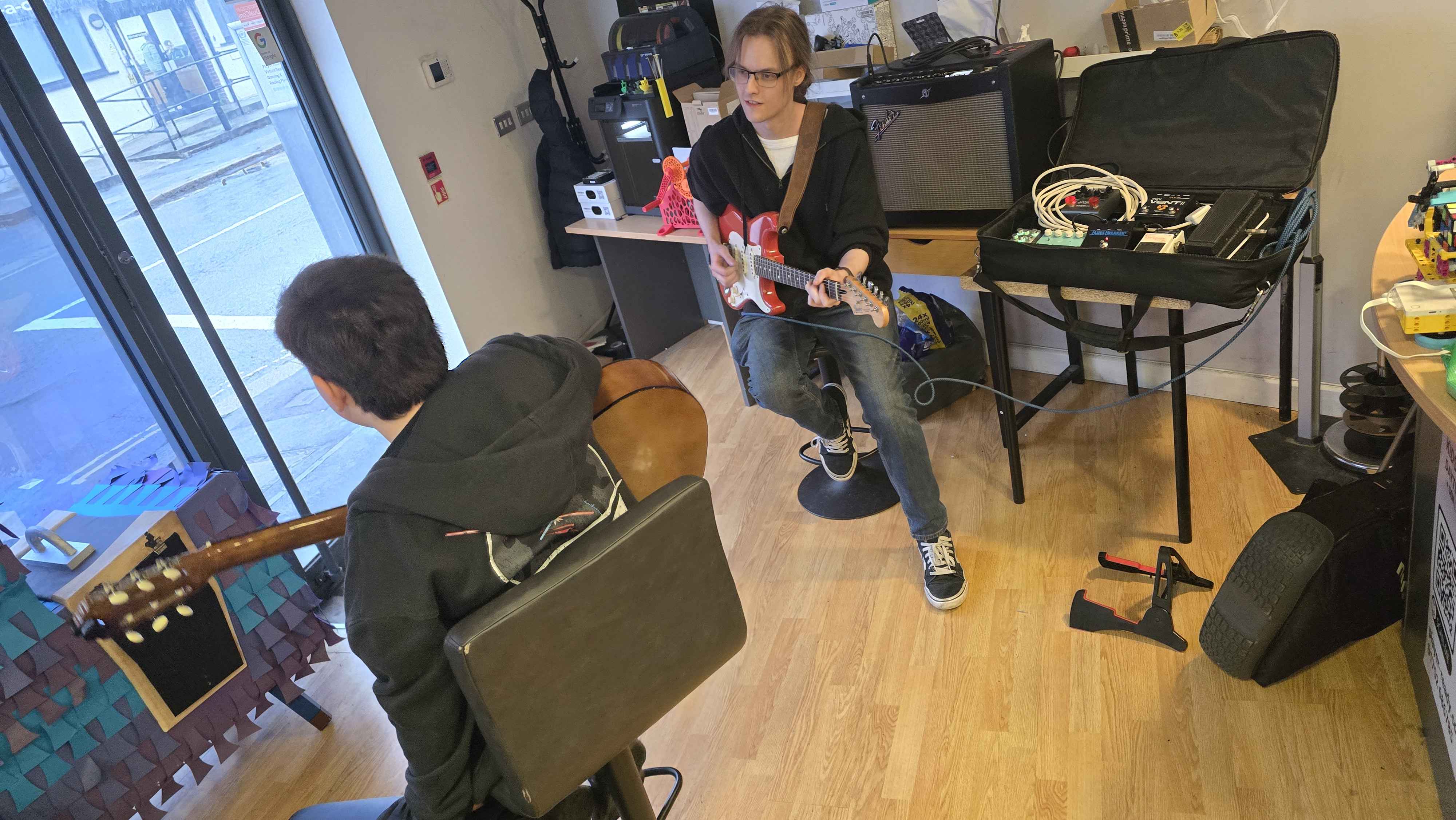 Guitar lesson session at Player Ready, where students explore music and technology together. Our mentoring programs include creative outlets like music alongside coding and tech skills, supporting wellbeing and self-expression.