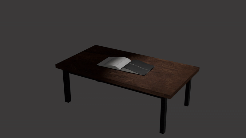 A beautifully rendered 3D model of a low coffee table with realistic wood textures and materials. The student has demonstrated strong skills in 3D modelling, lighting, and rendering, creating a professional-looking furniture piece with attention to detail including an open book and laptop on the surface.
