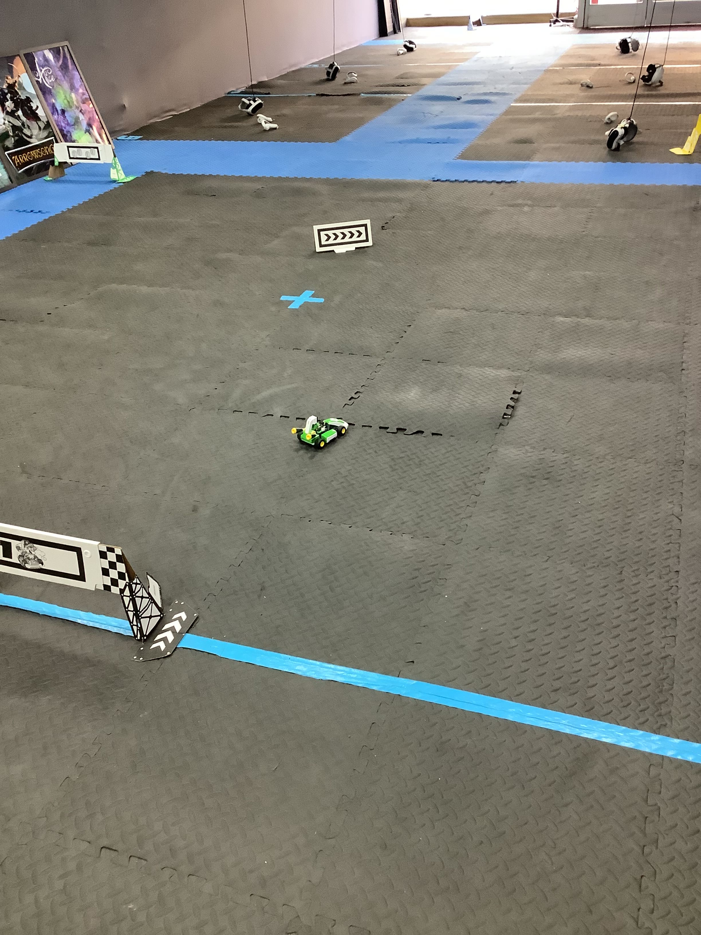Students designed and built an exciting racing track course for remote-controlled cars, complete with directional markers, checkered flags, and a challenging winding path. This hands-on project combines physical design, problem-solving, and competitive fun as participants test their driving skills on the custom track layout.