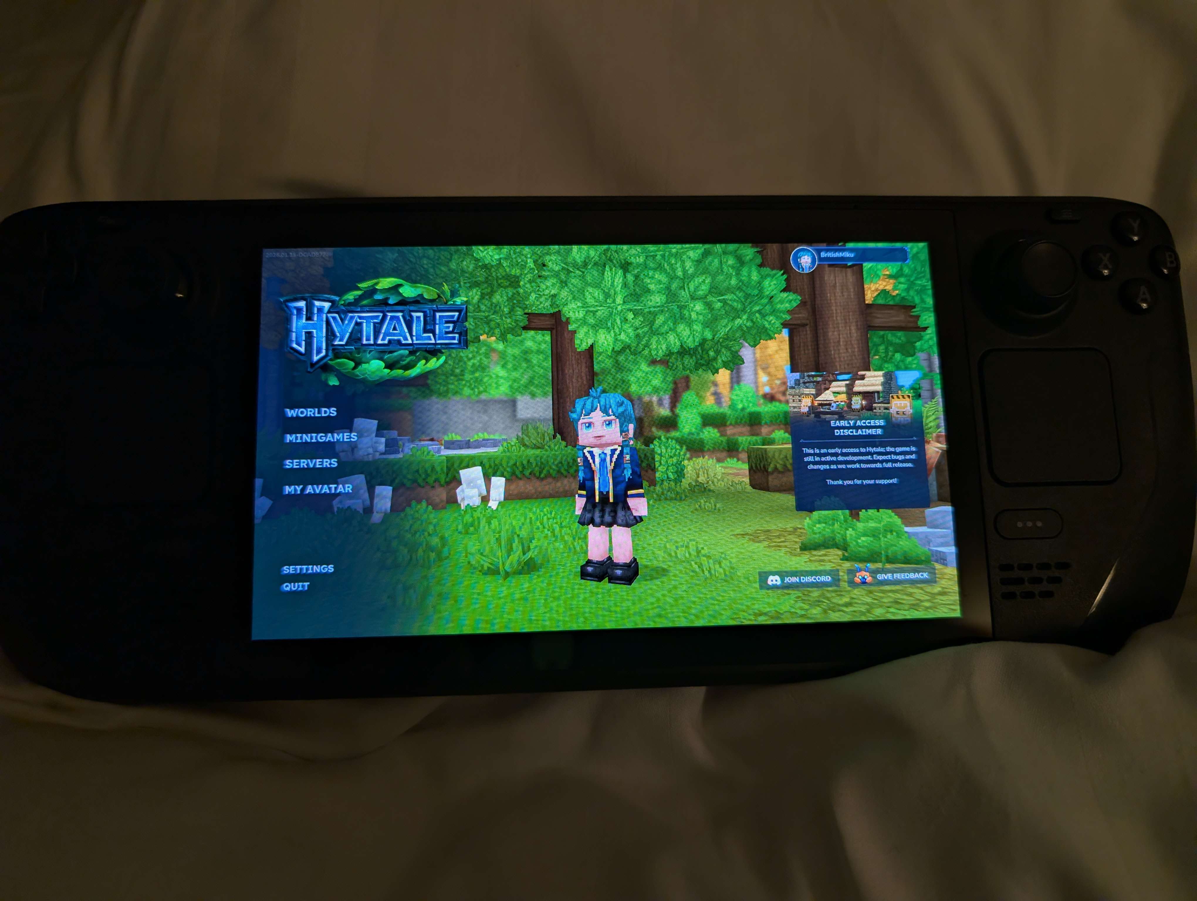 A student explores the Hytale game interface on a handheld gaming device during their session. The vibrant blocky world and character customization showcase their engagement with sandbox gaming environments.