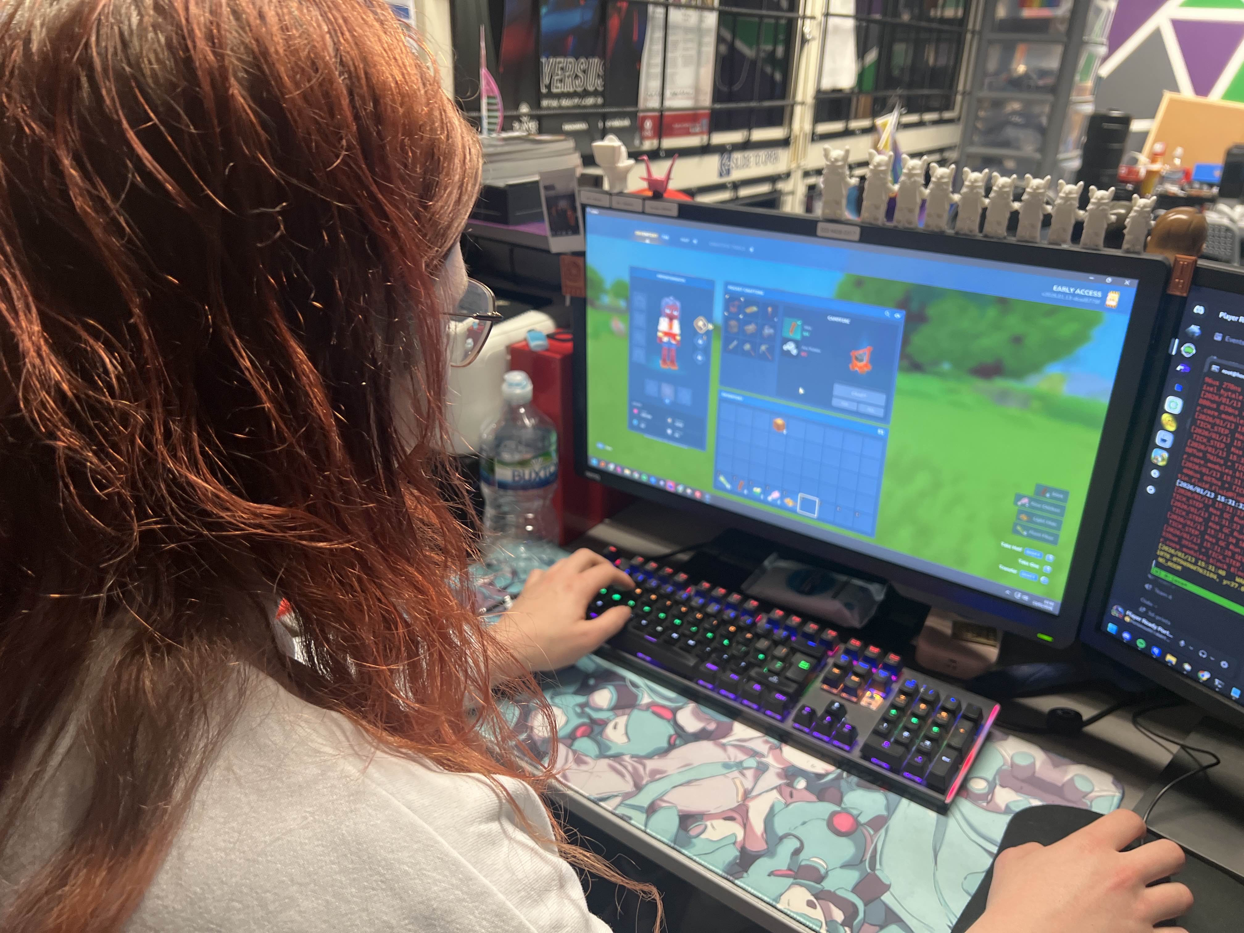 A student working on a creative Roblox game development project, designing interactive gameplay elements and environments. Great focus and engagement during the coding session!