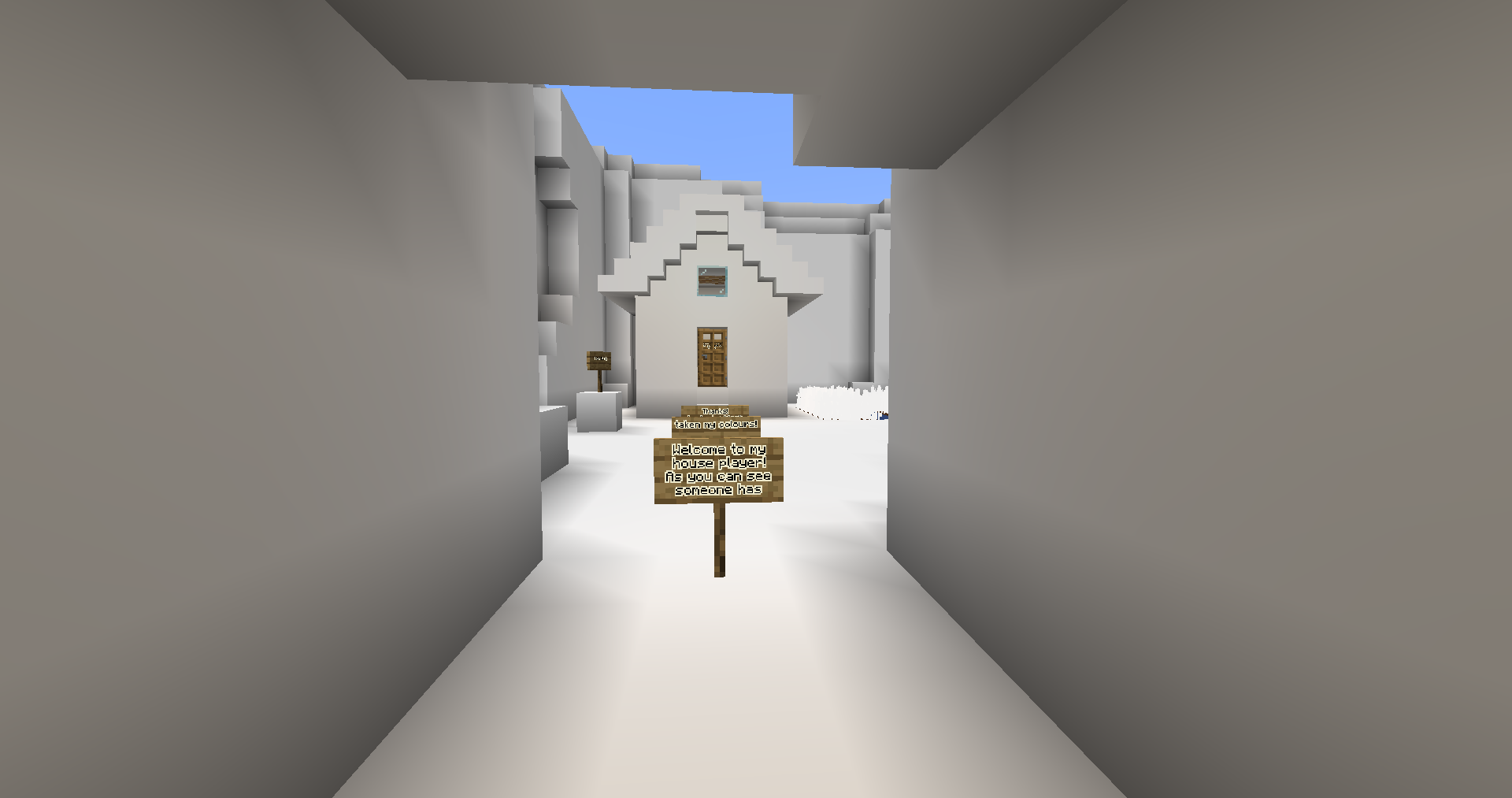 A student has created a welcoming courtyard environment in Minecraft, complete with custom buildings, decorative archways, and personalized signage inviting visitors to explore. This build showcases creative design skills and attention to architectural detail.