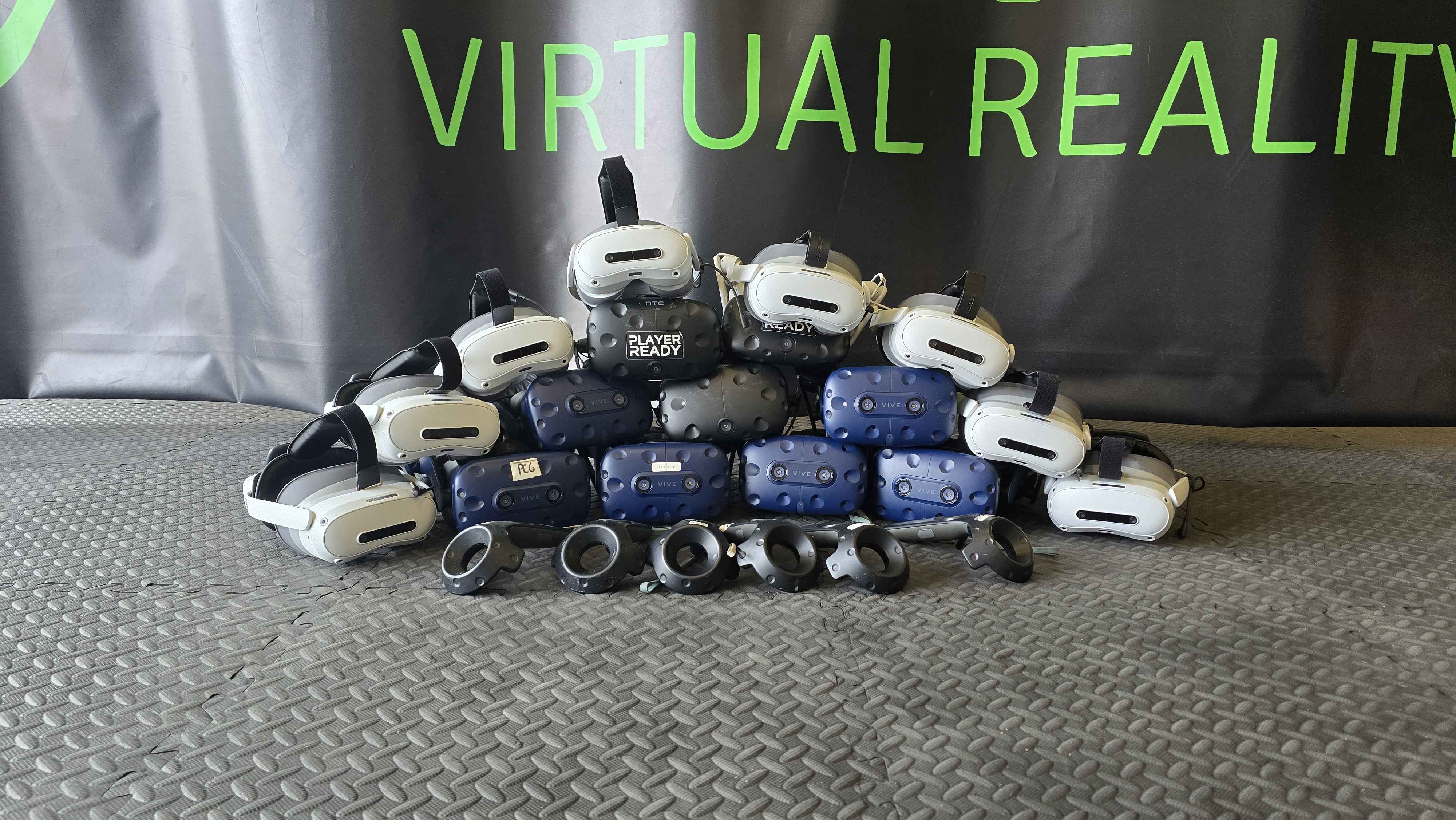 Player Ready's impressive collection of VR headsets ready for action! Our VR gaming experiences use top-tier equipment including HTC Vive and other professional headsets, providing immersive virtual reality adventures for students and party guests alike.